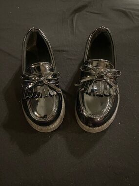 Girls Black Patent Fringe Loafers with Bow Accent